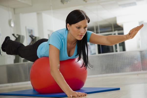 woman exercising on work out ball